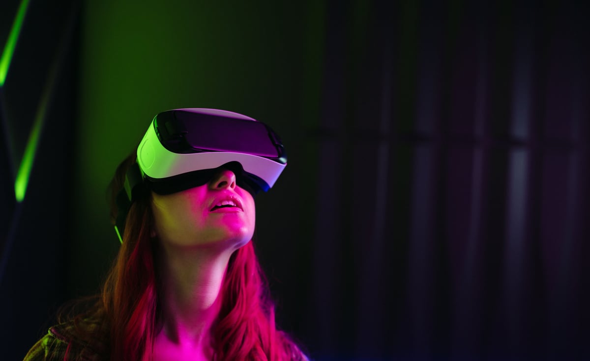 Woman exploring a virtual world through a VR headset